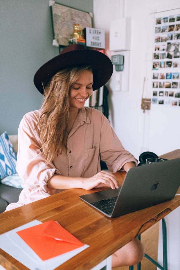 smiling woman using laptop